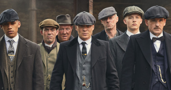 The cast of Peaky Blinders stood in a row in 1920s attire